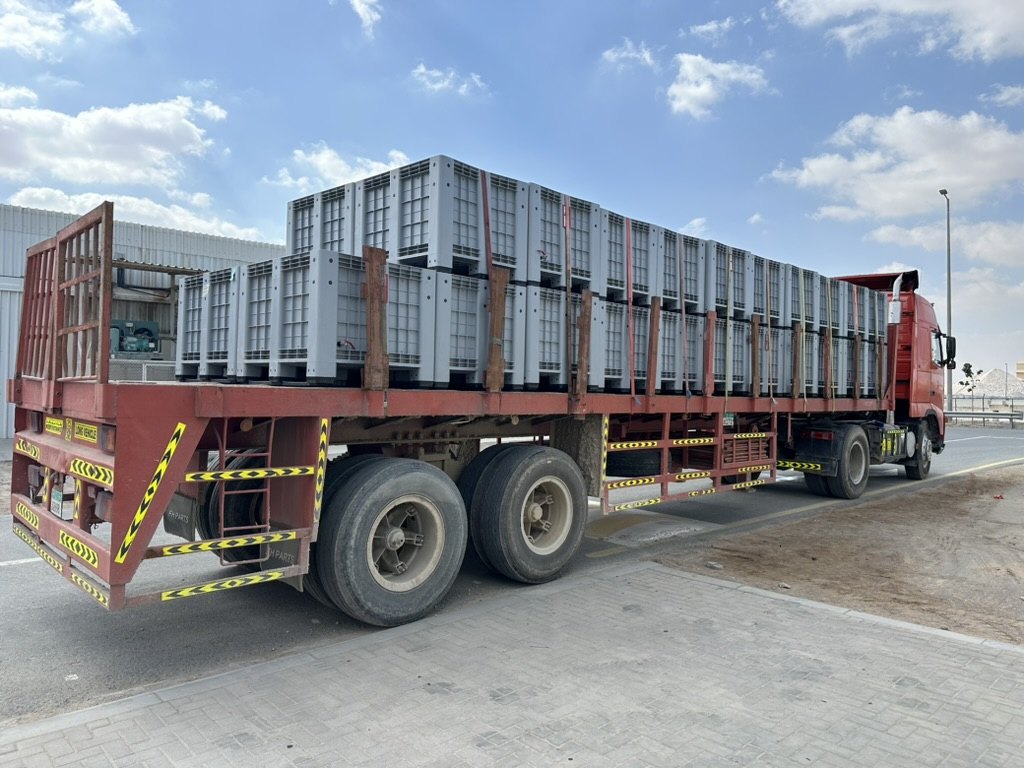 Collection boxes strapped down on a flatbed truck