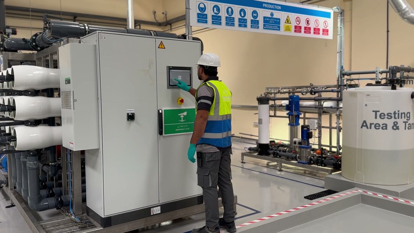 Operator in PPE at the control panel of the 2ndLifeRevive regeneration plant